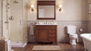 Antique brown Rocaille Victorian bathroom vanity in a bathroom with a mirror and wall sconces, doors closed