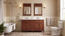 Antique brown Rocaille Victorian double vanity with white quartz top in a bathroom with two mirrors and clawfoot tub