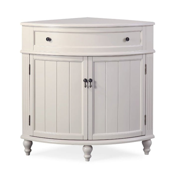 Front view of the taupe Triadsville 24 inch corner cabinet base with two curved beadboard doors and turned feet, no top